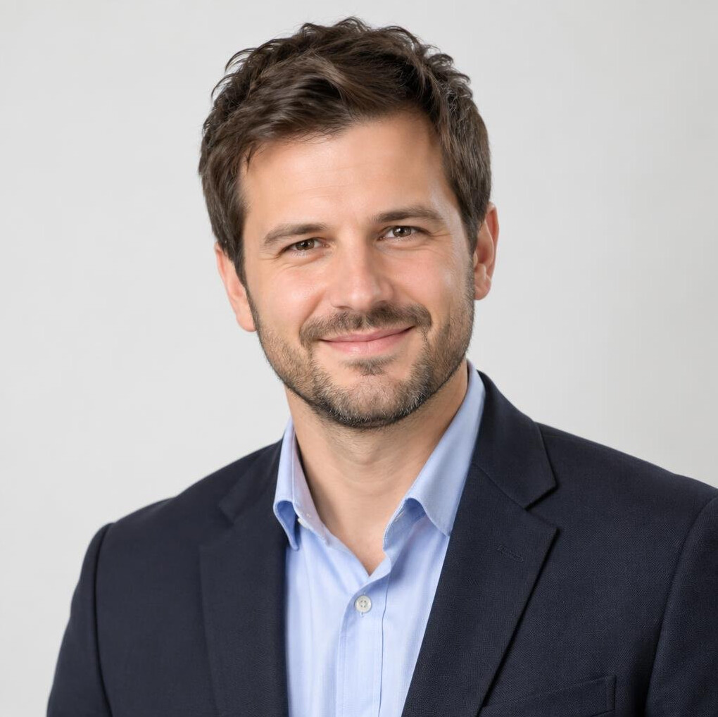 Studio portrait of a Slovenian man in a blazer